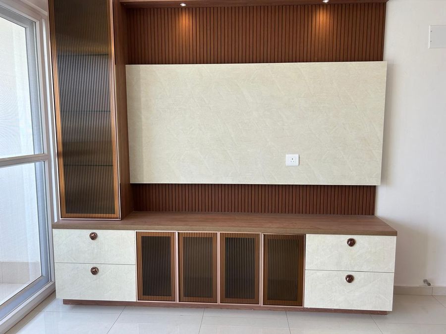 TV unit with wood slat panelling, fluted glass shutters and drawers